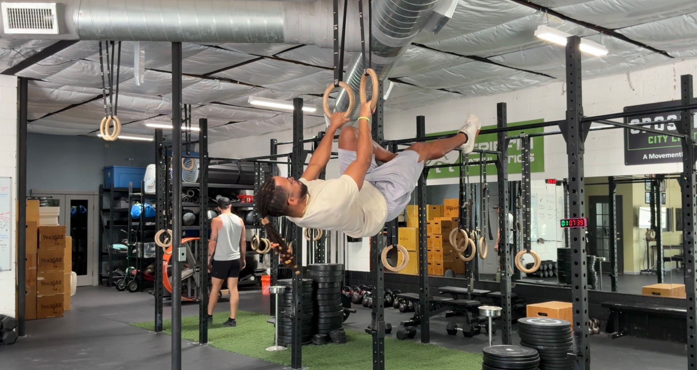 Colby White holding a front lever on gymnastic rings in Austin