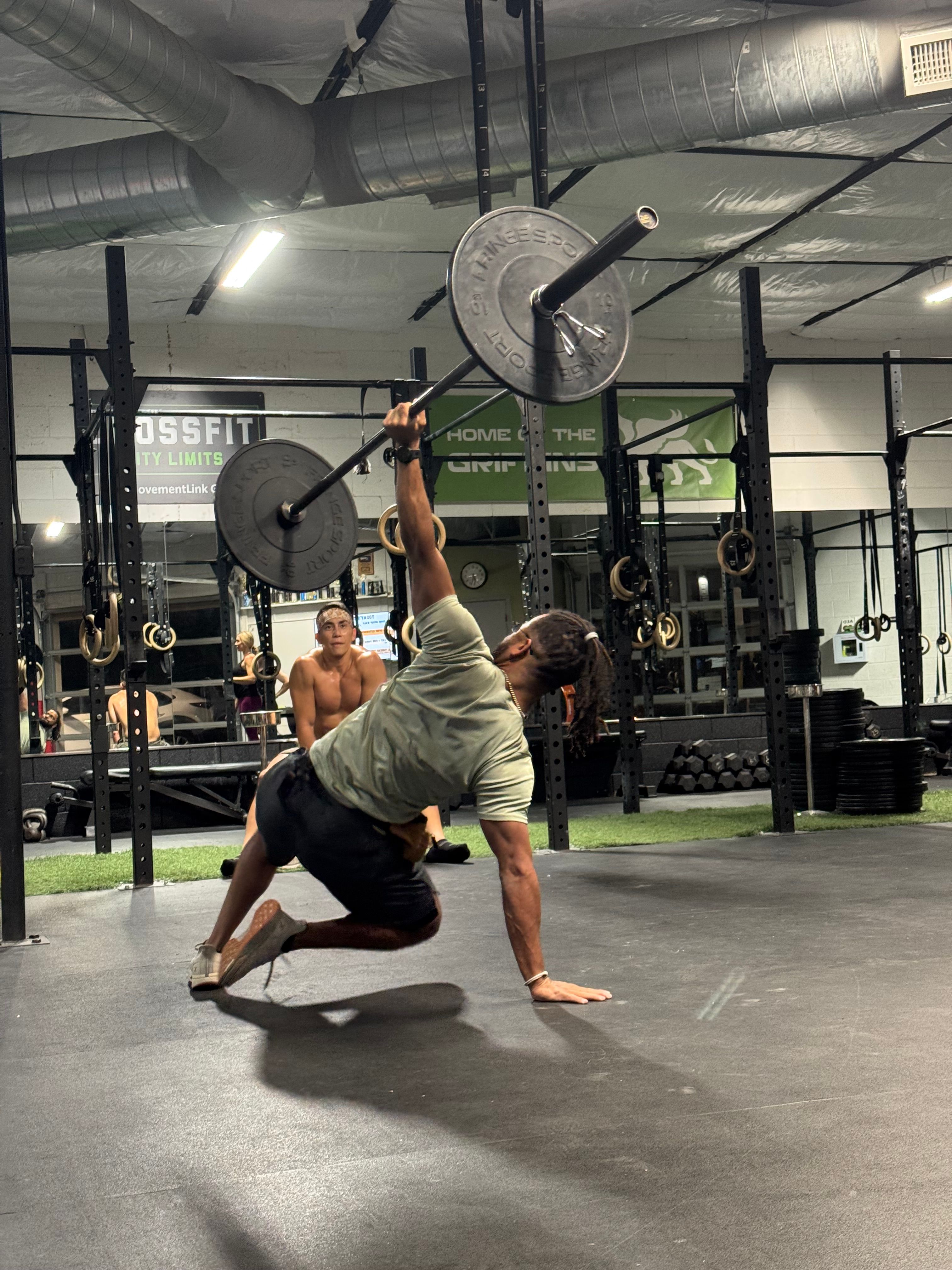 Colby White demonstrating a barbell get-up