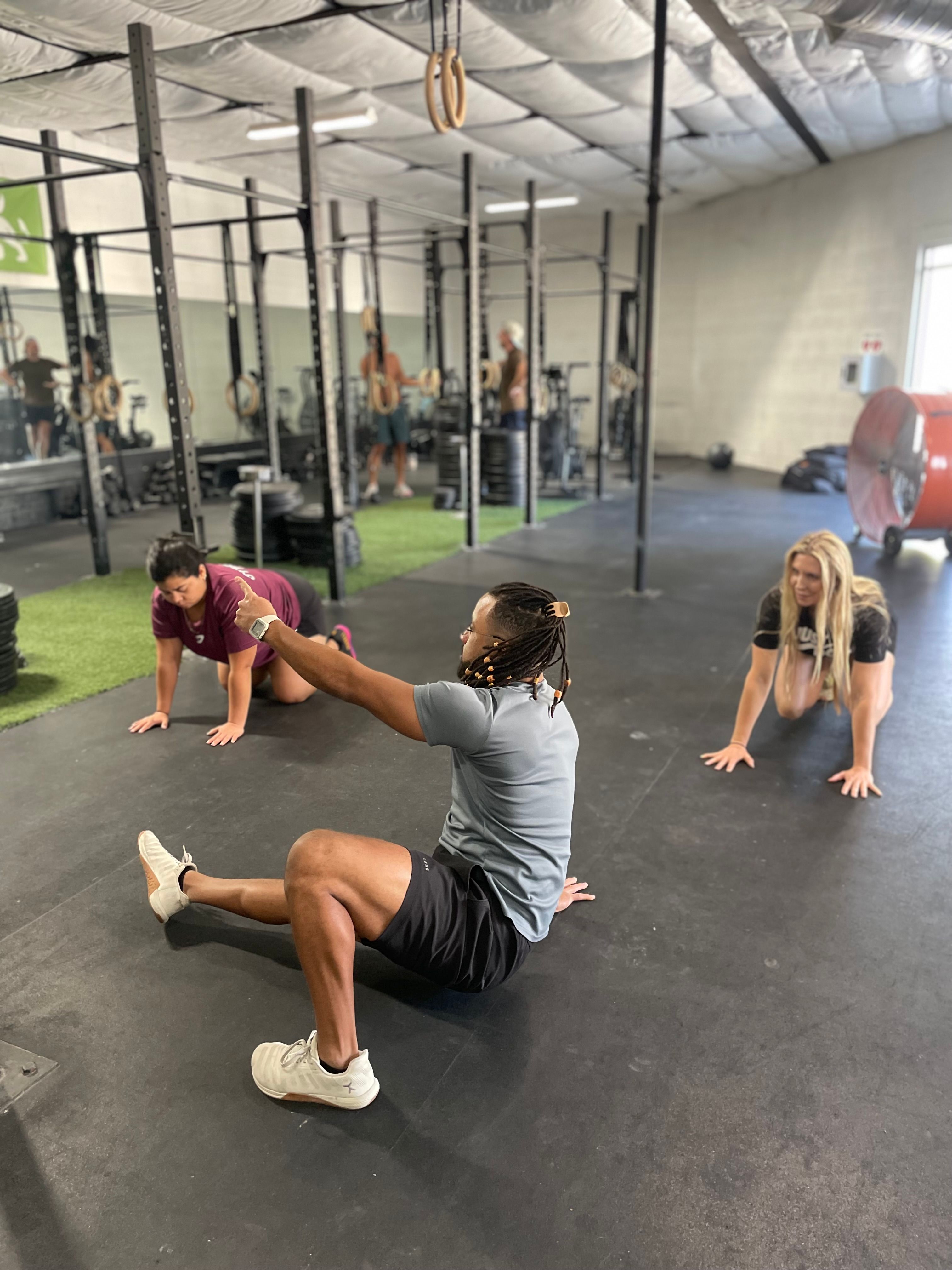 Colby White coaching an Animal Flow movement class in Austin